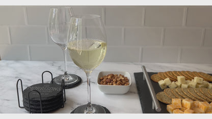 Video Pouring white wine showing personalized round coasters with snacks